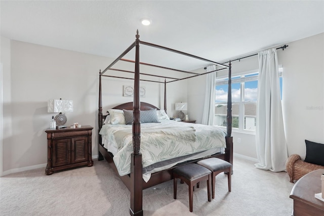 bedroom featuring carpet floors and baseboards