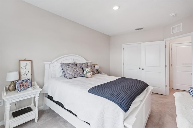bedroom featuring light colored carpet