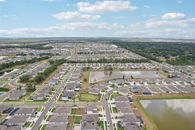 aerial overview of property's location with nearby suburban area and a large body of water
