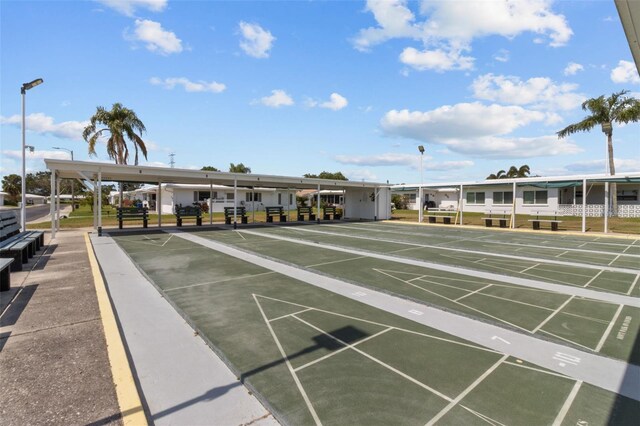9743 36th Way N Unit 4, Pinellas Park, FL 33782 - view of community with uncovered parking and shuffleboard