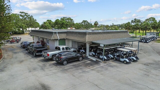 9743 36th Way N Unit 4, Pinellas Park, FL 33782 - covered parking lot with view of wooded area