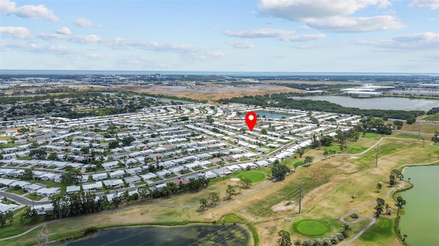 9743 36th Way N Unit 4, Pinellas Park, FL 33782 - aerial view of property and surrounding area featuring a nearby body of water, nearby suburban area, and a local golf course