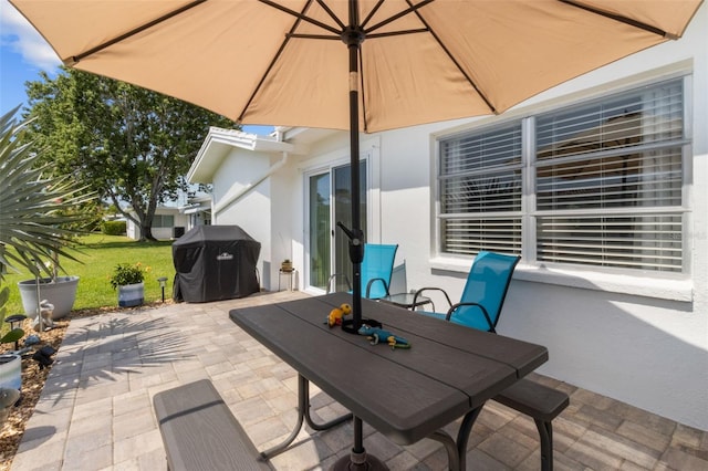 9743 36th Way N Unit 4, Pinellas Park, FL 33782 - view of patio featuring outdoor dining area and grilling area