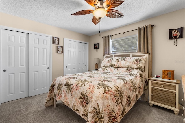 9743 36th Way N Unit 4, Pinellas Park, FL 33782 - bedroom with carpet floors, multiple closets, a textured ceiling, and a ceiling fan