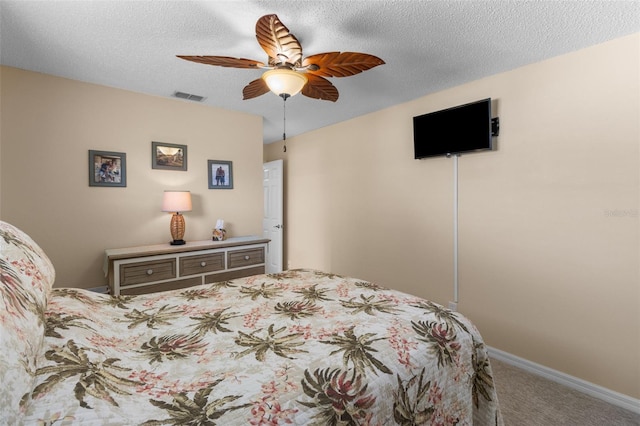 9743 36th Way N Unit 4, Pinellas Park, FL 33782 - bedroom featuring carpet, a textured ceiling, and a ceiling fan