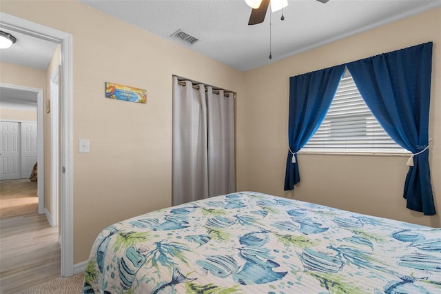 9743 36th Way N Unit 4, Pinellas Park, FL 33782 - carpeted bedroom featuring baseboards, ceiling fan, and a textured ceiling