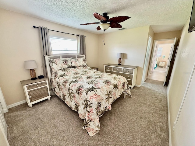 9743 36th Way N Unit 4, Pinellas Park, FL 33782 - carpeted bedroom featuring a textured ceiling and ceiling fan