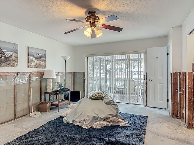 1011 SE 4th Ave, Crystal River, FL 34429 - bedroom with a ceiling fan, a textured ceiling, and access to exterior