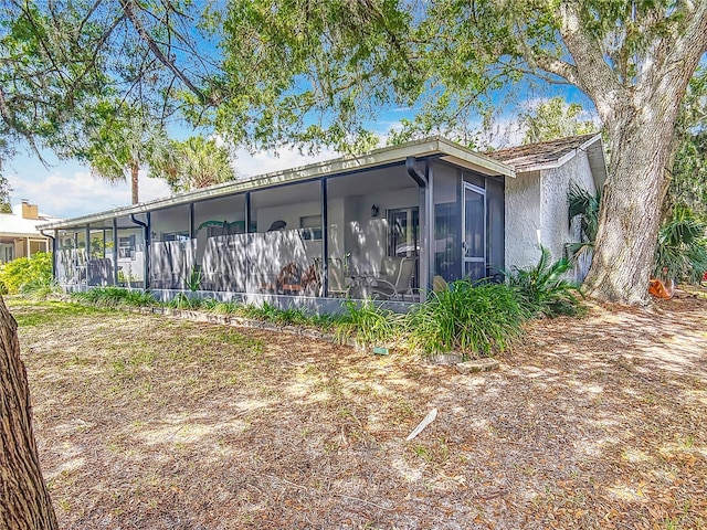 1011 SE 4th Ave, Crystal River, FL 34429 - back of house with a sunroom