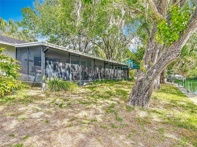 1011 SE 4th Ave, Crystal River, FL 34429 - back of house featuring a sunroom