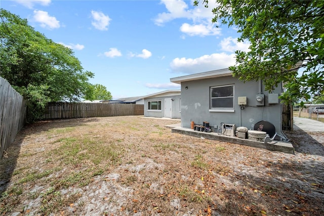 view of yard with a fenced backyard