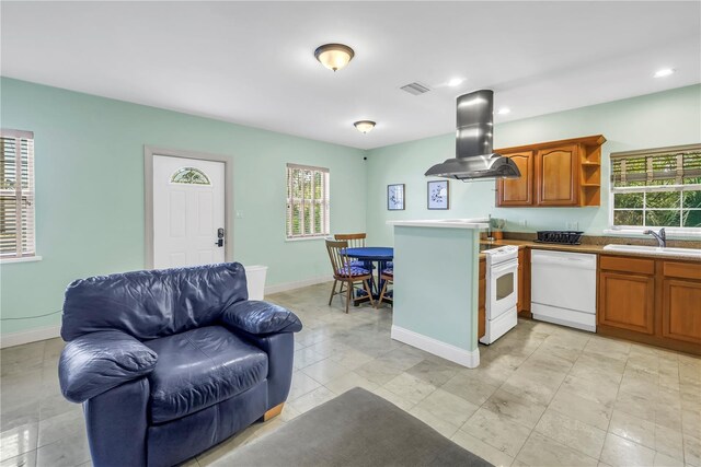 6515 Dimarco Rd, Tampa, FL 33634 - kitchen with white appliances, island range hood, a sink, open shelves, and plenty of natural light