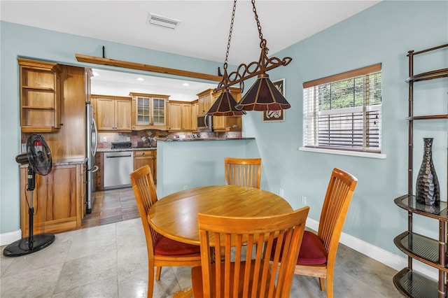 6515 Dimarco Rd, Tampa, FL 33634 - dining space featuring baseboards