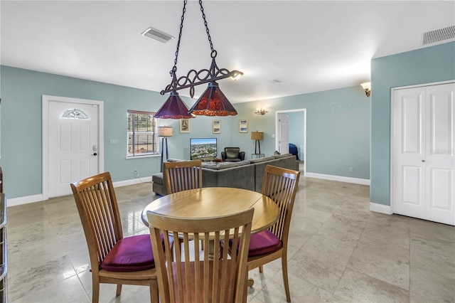 6515 Dimarco Rd, Tampa, FL 33634 - dining space featuring baseboards