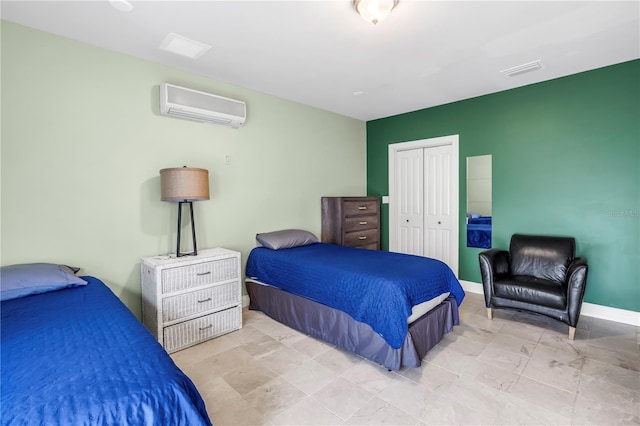 6515 Dimarco Rd, Tampa, FL 33634 - bedroom with a wall mounted AC, a closet, and baseboards