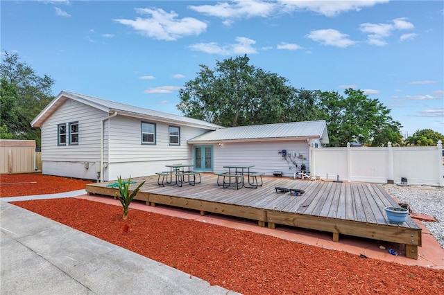 6515 Dimarco Rd, Tampa, FL 33634 - back of house with fence, a deck, and french doors
