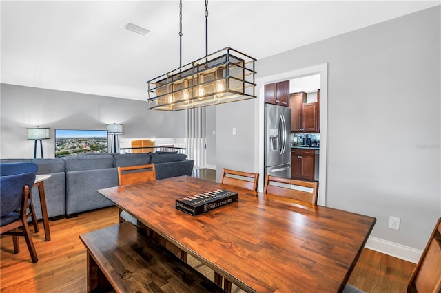 6515 Dimarco Rd, Tampa, FL 33634 - dining space with light wood finished floors and baseboards