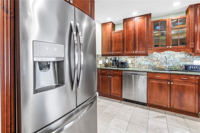 6515 Dimarco Rd, Tampa, FL 33634 - kitchen with stainless steel appliances, dark stone countertops, tasteful backsplash, glass insert cabinets, and recessed lighting