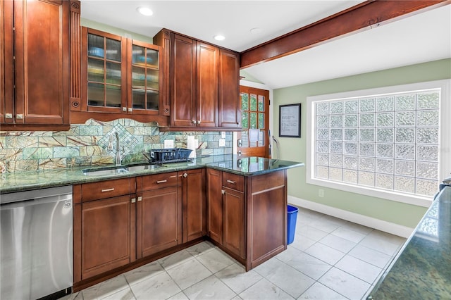 6515 Dimarco Rd, Tampa, FL 33634 - kitchen featuring dishwasher, a sink, baseboards, dark stone countertops, and tasteful backsplash