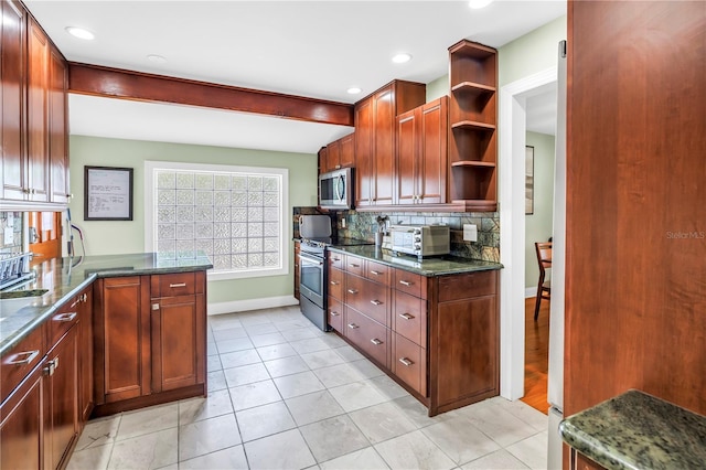 6515 Dimarco Rd, Tampa, FL 33634 - kitchen with stainless steel appliances, baseboards, open shelves, decorative backsplash, and dark stone countertops
