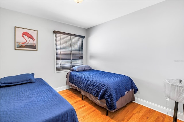 6515 Dimarco Rd, Tampa, FL 33634 - bedroom featuring light wood-style flooring and baseboards
