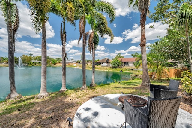 property view of water with a fire pit