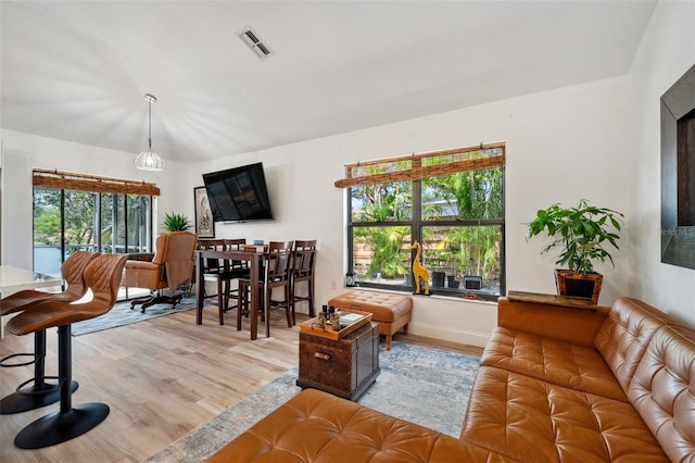 living room with visible vents and wood finished floors