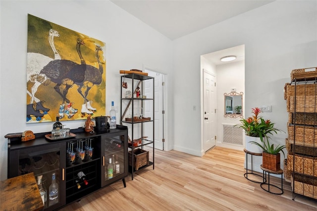 interior space featuring visible vents, wood finished floors, and baseboards