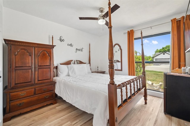 bedroom featuring light wood-style floors, access to outside, and ceiling fan
