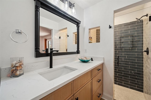 full bath with a stall shower and vanity