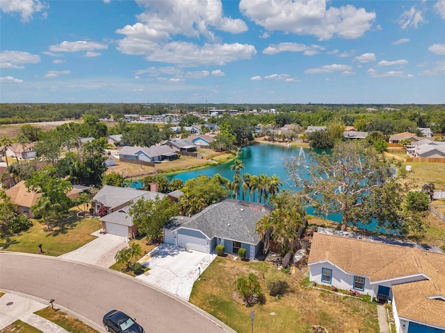 aerial view with a water view and a residential view