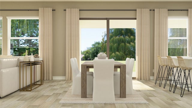 6909 E 116th Ct, Palmetto, FL 34221 - dining space featuring a wealth of natural light, wood finished floors, and baseboards