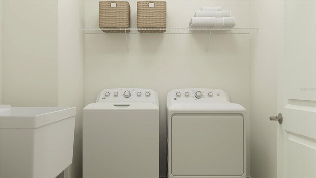 6909 E 116th Ct, Palmetto, FL 34221 - washroom featuring washer and dryer, laundry area, and a sink