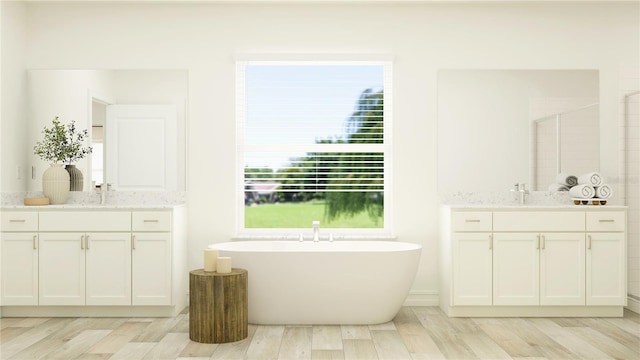 6909 E 116th Ct, Palmetto, FL 34221 - full bath with two vanities, a freestanding bath, a sink, and wood finished floors