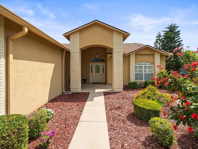 property entrance with stucco siding