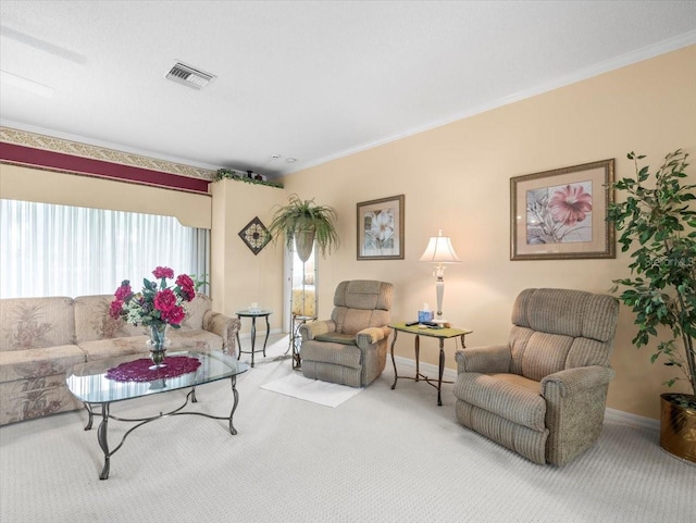 living area with carpet, baseboards, and ornamental molding