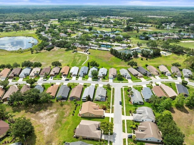 aerial overview of property's location featuring nearby suburban area and a large body of water