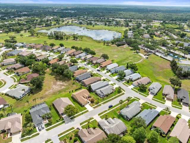 aerial overview of property's location with a nearby body of water and nearby suburban area