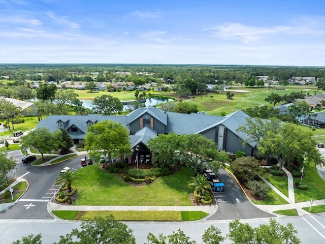 aerial perspective of suburban area with a nearby body of water