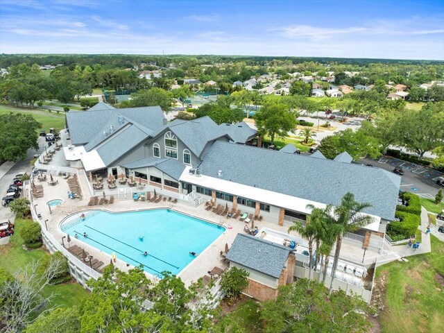 view of subject property with a pool area