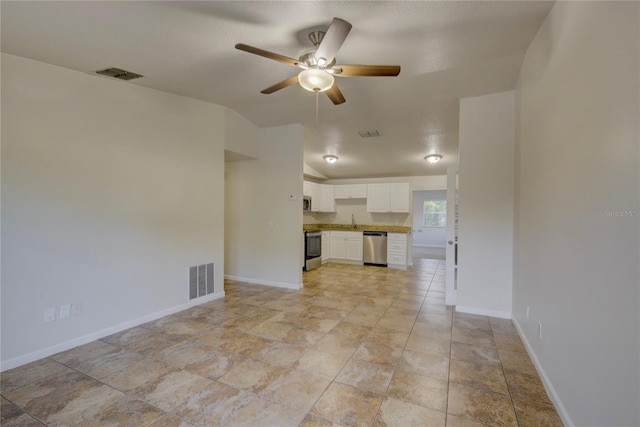 10319 Widgeon Way, New Port Richey, FL 34654 - unfurnished living room featuring a ceiling fan, baseboards, and a sink