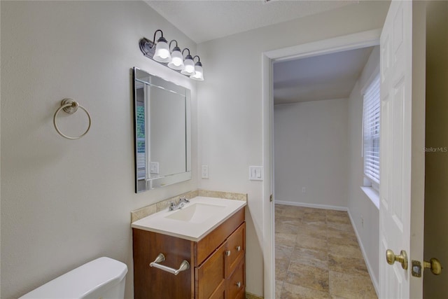 10319 Widgeon Way, New Port Richey, FL 34654 - half bathroom with toilet, vanity, and baseboards