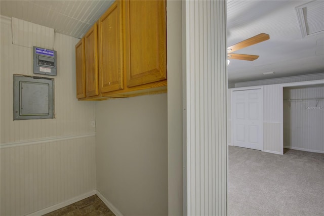 10319 Widgeon Way, New Port Richey, FL 34654 - clothes washing area with electric panel, ceiling fan, carpet floors, and baseboards