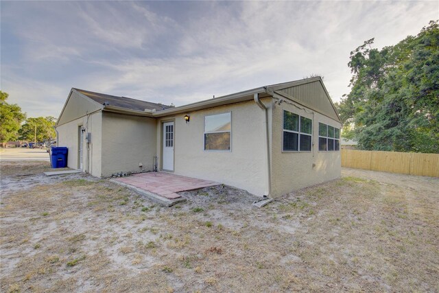 10319 Widgeon Way, New Port Richey, FL 34654 - back of property featuring fence and stucco siding