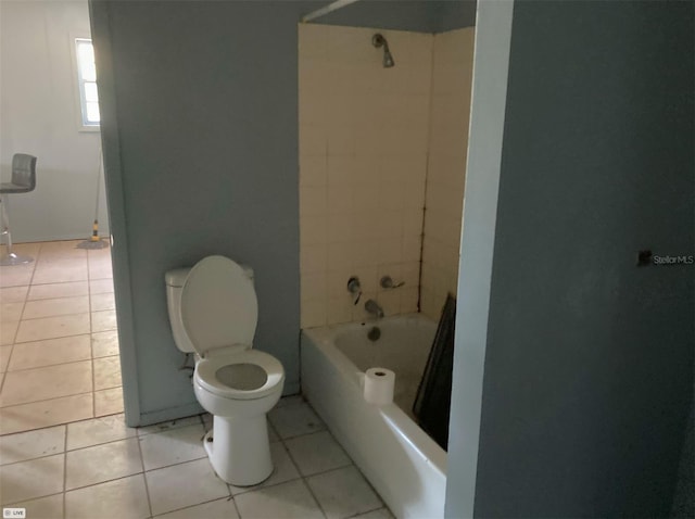full bathroom with tile patterned floors, toilet, and  shower combination