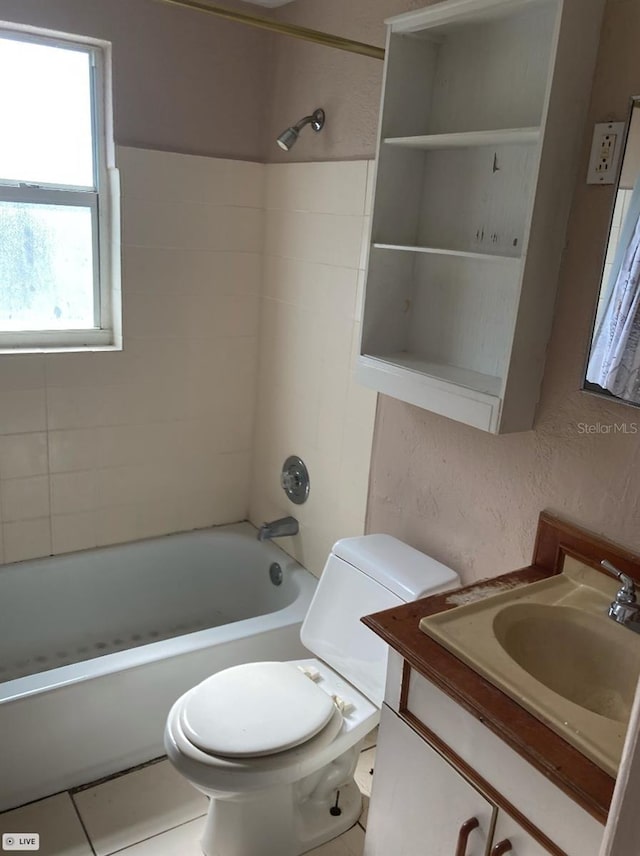 bathroom featuring toilet, shower / tub combination, and vanity