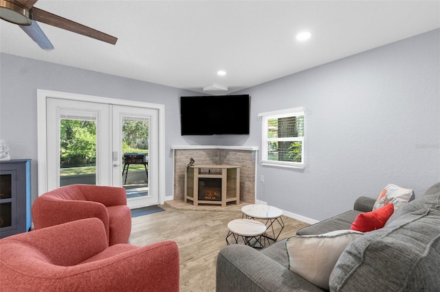 5421 Gay St, Weeki Wachee, FL 34607 - living room with baseboards, a ceiling fan, a brick fireplace, and recessed lighting