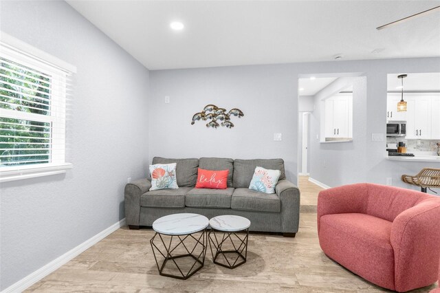 5421 Gay St, Weeki Wachee, FL 34607 - living area with baseboards, light wood-type flooring, and recessed lighting