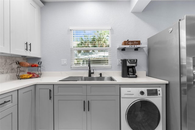 5421 Gay St, Weeki Wachee, FL 34607 - laundry area with washer / clothes dryer, laundry area, and a sink