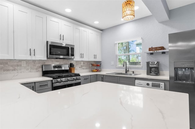 5421 Gay St, Weeki Wachee, FL 34607 - kitchen featuring a sink, open shelves, light stone countertops, appliances with stainless steel finishes, and tasteful backsplash